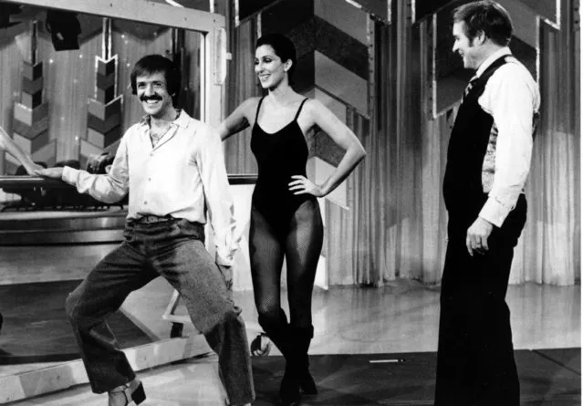 Sonny Bono, left, and his ex-wife, Cher clown before Mike Douglas during the taping of the Mike Douglas Show in Los Angeles, Ca., Monday, January 23, 1979.  Cher co-hosts a week with Douglas to air beginning Feb. 26. (Photo by AP Photo)