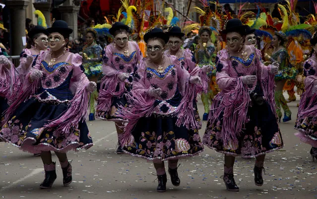 Traditional “Morenada” dancers perform during the Carnival in Oruro, Bolivia, Saturday, February 10, 2018. (Photo by Juan Karita/AP Photo)