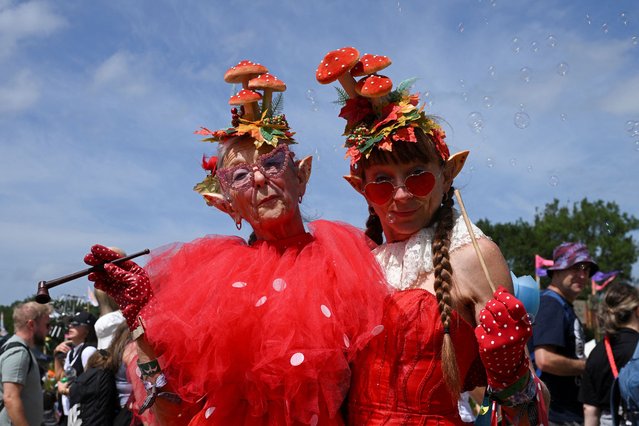 Revellers pose for a photo as they attend Glastonbury Festival at Worthy Farm in Pilton, Somerset, Britain, on June 26, 2025. (Photo by Jaimi Joy/Reuters)