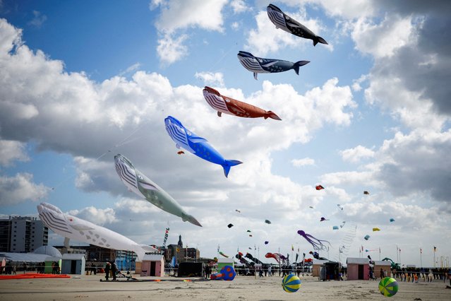Kites fly over the beach during the 37th International Berck-sur-Mer Kite Festival, in the northern French resort of Berck-sur-Mer, France on April 21, 2024. (Photo by Sarah Meyssonnier/Reuters)