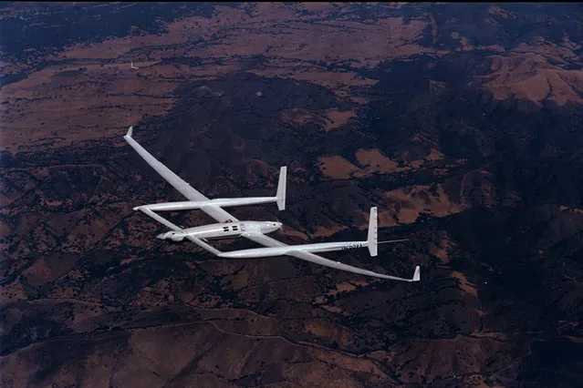 This is a December 5, 1986 photo of the twin-engine, pusher-puller experimental aircraft named Voyager during a training flight before her historic first non-stop, un-refueled flight around the world.  The plane took off from Edwards Air Force Base, Calif., Dec. 14, 1986 with 1,200 gallons of fuel onboard and returned to the desert base nine days later on Dec. 23 with 18 gallons to spare. (Photo by Douglas C. Pizac/AP Photo)