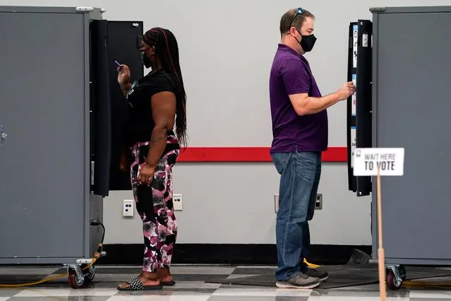 Voters cast their election ballots at a Fulton County polling station in Atlanta, Georgia, U.S. October 13, 2020. (Photo by Elijah Nouvelage/Reuters)