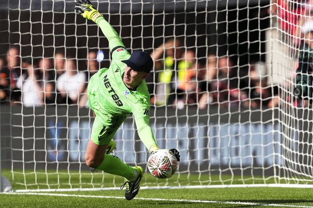 Crystal Palace's goalkeeper Dean Henderson saves during penalty shootout during the FA Community Shield final soccer match between Liverpool and Crystal Palace at Wembley Stadium in London,Sunday, August 10, 2025. (Photo by Dave Shopland/AP Photo)