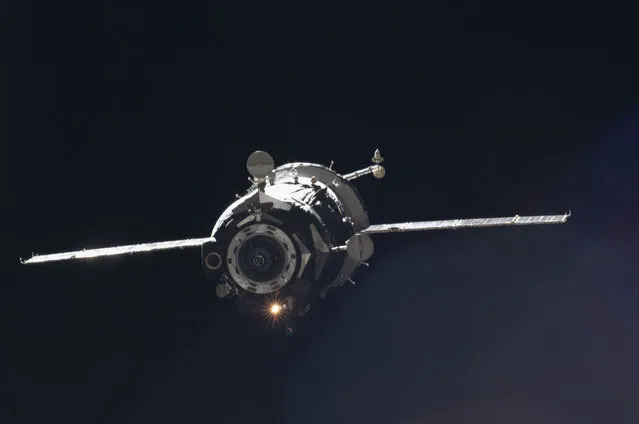 The Soyuz TMA-05M spacecraft departs from the International Space Station and heads toward a landing in a remote area outside the town of Arkalyk, Kazakhstan, on November 19, 2012 (Kazakhstan time). NASA astronaut Sunita Williams, Expedition 33 commander; Russian cosmonaut Yuri Malenchenko, Soyuz commander and flight engineer; and Japan Aerospace Exploration Agency astronaut Aki Hoshide, flight engineer, returned from four months onboard the space station where they served as members of the Expedition 32 and 33 crews. (Photo by NASA/The Atlantic)