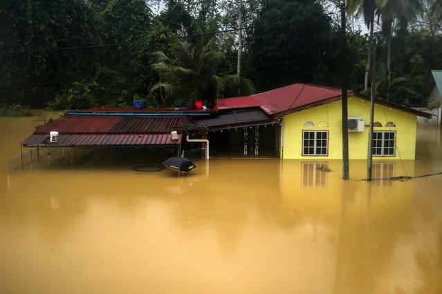 A house is flooded by rain water in Segamat, Johor, Malaysia, 03 March 2023. According to state media, more than 33,000 people were evacuated in four states affected by the floods. (Photo by Fazry Ismail/EPA)