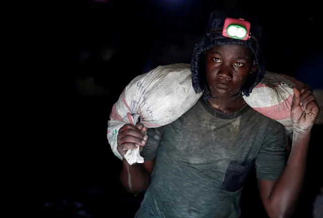 A young gold miner works in Makala gold mine camp near the town of Mongbwalu in Ituri province, eastern Democratic Republic of Congo on April 7, 2018. (Photo by Goran Tomasevic/Reuters)