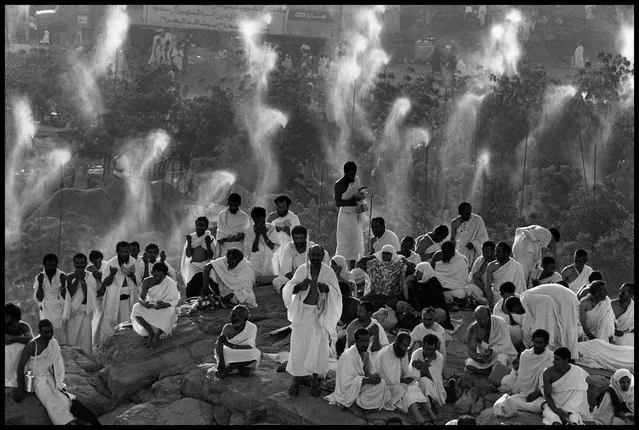 Mecca, Saudi Arabia, 1992. Pilgrims from around the world pray on Mount Rahma, where Muslims believe Adam met Eve. (Photo by Abbas Attar/Magnum Photos)