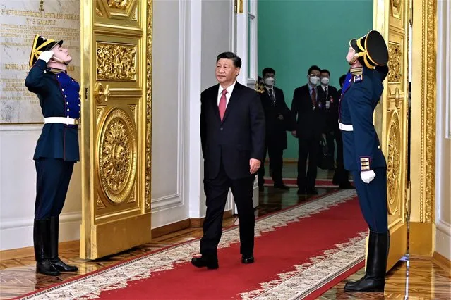 Chinese President Xi Jinping enters a hall to attend an official welcome ceremony with Russian President Vladimir Putin at The Grand Kremlin Palace, in Moscow, Russia, Tuesday, March 21, 2023. (Photo by Pavel Byrkin, Sputnik, Kremlin Pool Photo via AP Photo)