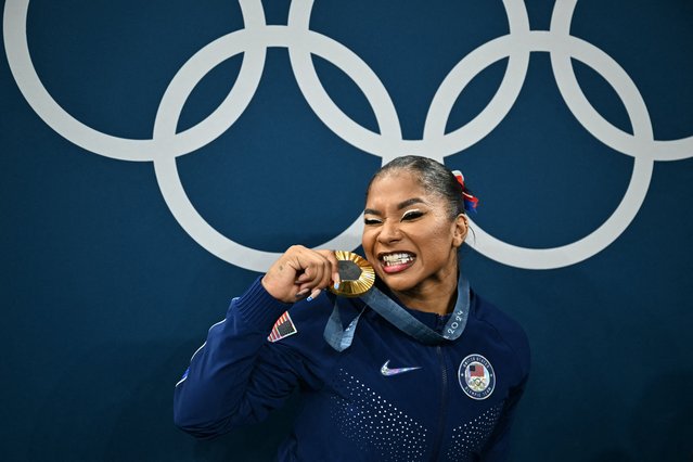 US' Jordan Chiles poses with the gold medal after the podium ceremony for the artistic gymnastics women's team final during the Paris 2024 Olympic Games at the Bercy Arena in Paris, on July 30, 2024. (Photo by Lionel Bonaventure/AFP Photo)