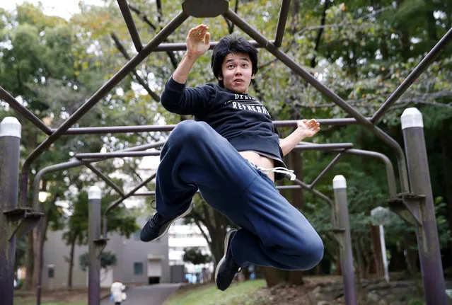 Jun Sato, founder of Japan's first parkour educational institute SENDAI X-TRAIN, demonstrates his parkour skill  at a park in Tokyo, Japan November 2, 2016. (Photo by Kim Kyung-Hoon/Reuters)