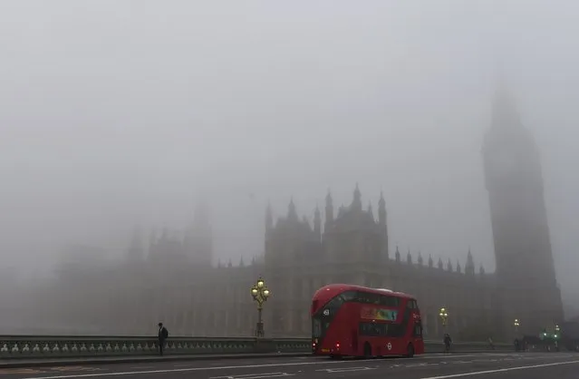 Workers cross Westminster Bridge towards the Houses of Parliament on a misty morning in London, Britain, November 2, 2015. (Photo by Toby Melville/Reuters)