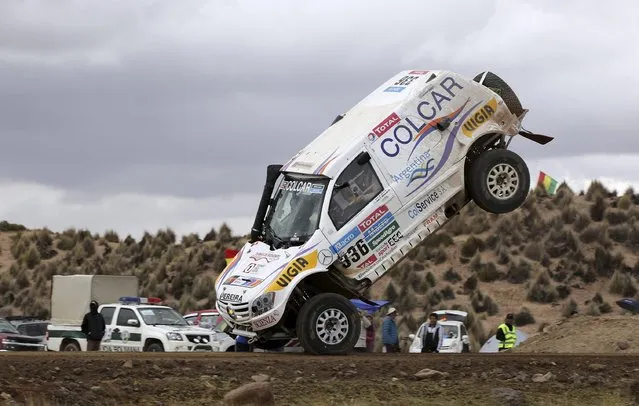 Argentine Juan Manuel Silva and Pablo Sisterna (not pictured) crash and roll their Mercedes car during the 7th stage of the Dakar Rally from Iquique to Uyuni, January 10, 2015. (Photo by Daniel Rodrigo/Reuters)