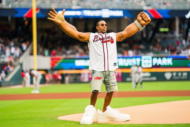 Ludacris reacts after throwing out the ceremonial first pitch before the game between the Atlanta Braves and the Colorado Rockies at Truist Park on September 4, 2024 in Atlanta, Georgia. (Photo by Kevin D. Liles/Atlanta Braves/Getty Images)