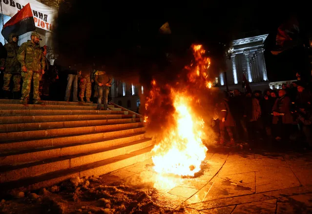 Activists of nationalist groups and their supporters burn tyres in Independence Square as they gather to mark the anniversary of the 2014 Ukrainian pro-European Union (EU) mass protests on the Day of Dignity and Freedom in central Kiev, Ukraine, November 21, 2016. (Photo by Valentyn Ogirenko/Reuters)