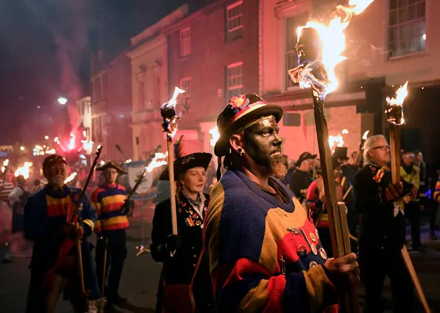 Participants parade through the town during the annual Bonfire Night festivities in Lewes, Britain on November 5, 2018. (Photo by Toby Melville/Reuters)