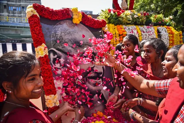 School students pay a floral tribute to a portrait of Mohandas Karamchand Gandhi to mark his 154th birth anniversary on the occasion of Gandhi Jayanti, at Egmore Museum, in Chennai, India, 02 October 2023. Gandhi Jayanti is celebrated annually across India on 02 October, to mark the birthday of Mohandas Karamchand Gandhi. This year marks the 154th birth anniversary of Mahatma Gandhi, also known as the father of the Indian nation. (Photo by Idrees Mohammed/EPA)