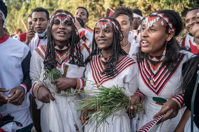 Women dressed in traditional clothing gather for the celebration of Irreecha, the Oromo people thanksgiving holiday in Bishoftu, Ethiopia, on October 8, 2023. (Photo by Amanuel Sileshi/AFP Photo)