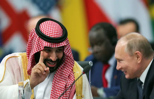 Saudi Arabia's Crown Prince Mohammed bin Salman speaks with Russia's President Vladimir Putin during the opening of the G20 leaders summit in Buenos Aires, Argentina November 30, 2018. (Photo by Sergio Moraes/Reuters)