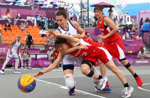 Giulia Rulli, back, of Italy, and Mai Yamamoto, of Japan battle for the ball during a women's 3-on-3 basketball game at the 2020 Summer Olympics, Monday, July 26, 2021, in Tokyo, Japan. (Photo by Andrew Boyers/Reuters)