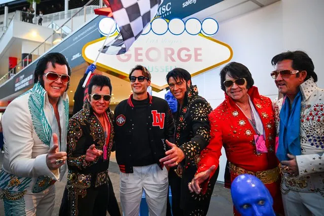 George Russell of Great Britain and Mercedes poses for a photo with a group of Elvis Presley impersonators in the Paddock during previews ahead of the F1 Grand Prix of Las Vegas at Las Vegas Strip Circuit on November 15, 2023 in Las Vegas, Nevada. (Photo by Clive Mason – Formula 1/Formula 1 via Getty Images)