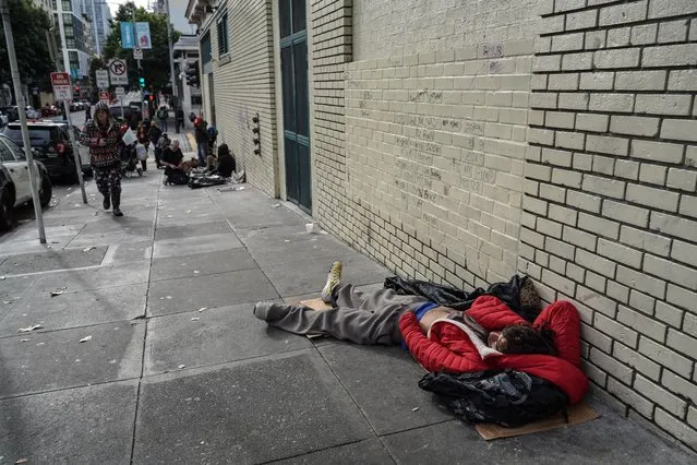 A homeless man sleeps on the street. The issue of homelessness remains a significant concern in San Francisco, California on December 1, 2023, with thousands of individuals living on the streets. Many of the homeless population are linked to various crimes, including drug-related activities and instances of theft. A policy has been implemented that providing homeless individuals with a minimum of 15 minutes to decide whether they wish to accept the city's offer of shelter. (Photo by Michael Ho Wai Lee/SOPA Images/Rex Features/Shutterstock)