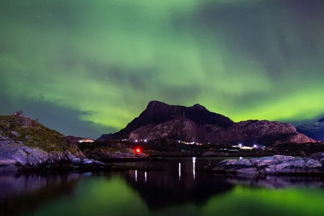 The Northern Lights appear in the sky in Svolvaer, Norway, on October 22, 2023. The Northern Lights occur due to the interplay between the sun and Earth's magnetic field, which propels electrons through the atmosphere at rapid velocities. (Photo by Manuel Romano/NurPhoto/Rex Features/Shutterstock)