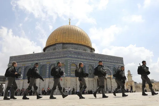 Israeli police maneuver through the Al Aqsa Mosque compound after Friday prayers to clear a protest a protest celebrating the six Palestinian prisoners who tunneled out of Gilboa Prison, in the Old City of Jerusalem, Friday, September 10, 2021. (Photo by Mahmoud Illean/AP Photo)