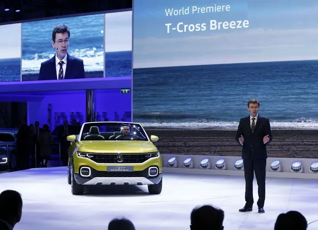Frank Welsch, member of the board of Volkswagen Brand, presents a Volkswagen T-Cross Breeze car during its w orld premiere at the 86th International Motor Show in Geneva, Switzerland, March 1, 2016. (Photo by Denis Balibouse/Reuters)