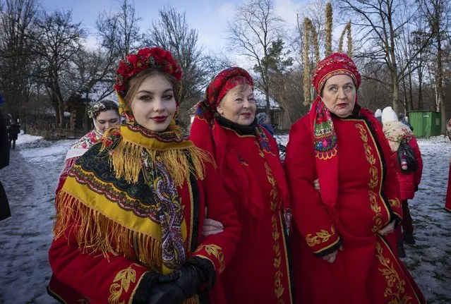 Women dressed in national suits celebrate Christmas in the village of Pirogovo outside capital Kyiv, Ukraine, Monday, December 25, 2023. (Photo by Efrem Lukatsky/AP Photo)