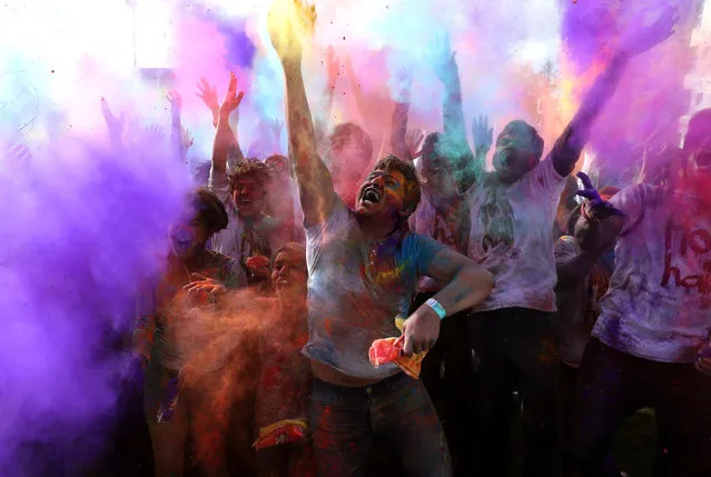 People celebrate Holi, the Hindu festival of colours, at Dundee University in Dundee, England on March 10, 2019. (Photo by Andrew Milligan/PA Wire Press Association)