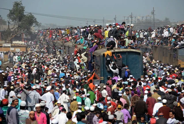 Bangladeshi Muslim devotees arrive on overcrowded trains to attend the Biswa Ijtema or World Muslim Congregation at Tongi, some 30 kms north of Dhaka on January 26, 2014. (Photo by Munir Uz Zaman/AFP Photo)