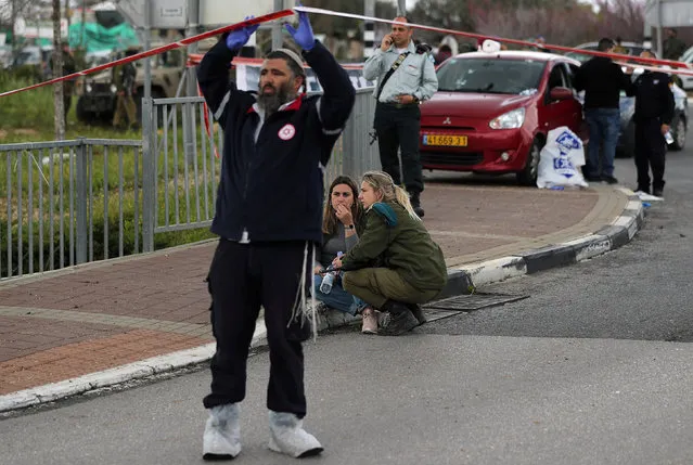 An Israeli soldier reacts at the scene of Palestinian shooting attack near the Jewish settlement of Ariel, in the occupied West Bank March 17, 2019. The attacks come at a sensitive time ahead of Israel's April 9 elections, and Prime Minister Benjamin Netanyahu vowed to apprehend the “terrorists” behind it. Hamas, the Islamist movement that runs the Gaza Strip, welcomed the attack, but did not claim responsibility for it. (Photo by Ammar Awad/Reuters)