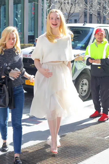 Elle Fanning is all radiant in all white ensemble while out and about in New York City on April 4, 2019. (Photo by Felipe Ramales/Splash News and Pictures)