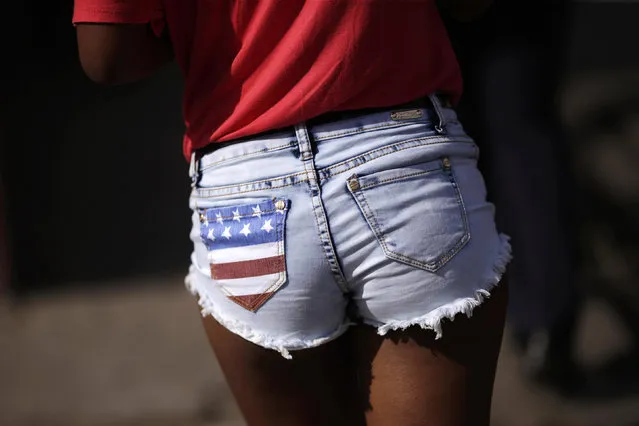 A young woman wears shorts with a patch in the U.S. flag's colors while walking in Havana, Cuba March 18, 2016. (Photo by Ueslei Marcelino/Reuters)