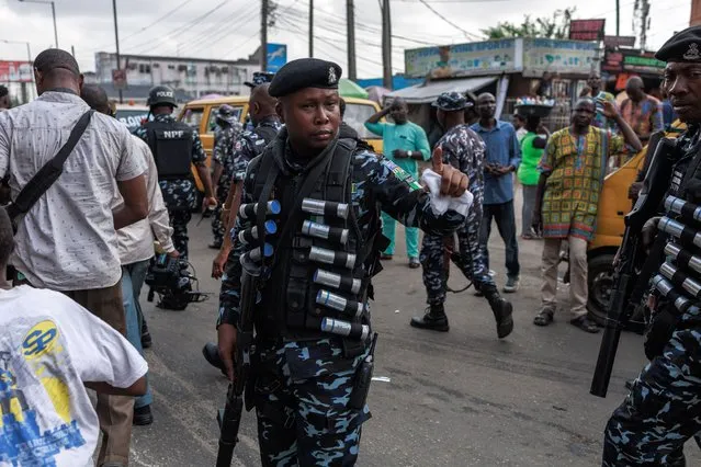 Nigerian anti-riot policemen are deployed during the Joint Action Front (JAF) and the Coalition for Revolution (CORE) nationwide protest against the government policies of Nigerian President Bola Tinubu in Lagos on February 26, 2024. (Photo by Benson Ibeabuchi/AFP Photo)