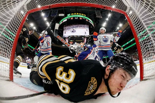 Boston Bruins center Morgan Geekie (39) is dumped into the Edmonton Oilers net during the second period at TD Garden in Boston, Massachusetts on March 5, 2024. (Photo by Winslow Townson/USA TODAY Sports)