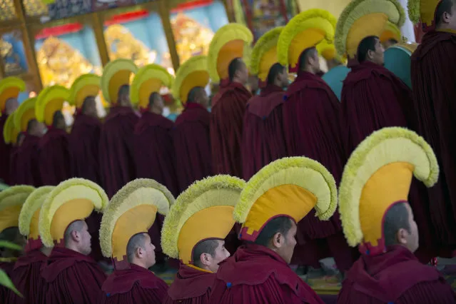 Exile Tibetan Buddhist monks in ceremonial hats participate in a special prayer meant to ward off evil spirits to prepare for the Tibetan New Year at the Gyuto monastery near Dharmsala, India, Tuesday, February 14, 2017. Tibetans all over the world will usher in the new year on Feb. 27 with prayers and festivities. (Photo by Ashwini Bhatia/AP Photo)