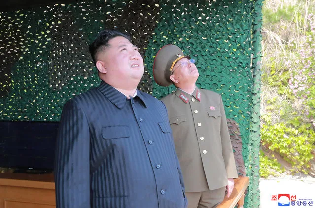 This Saturday, May 4, 2019, photo provided on Sunday, May 5, 2019, by the North Korean government shows North Korean leader Kim Jong Un observing tests of different weapons systems, in North Korea. North Korean state media on Sunday said leader Kim observed live-fire drills of long-range multiple rocket launchers and unspecified tactical guided weapons, a day after South Korea’s military detected the North launching several unidentified short-range projectiles into the sea off its eastern coast. Independent journalists were not given access to cover the event depicted in this image distributed by the North Korean government. The content of this image is as provided and cannot be independently verified. Korean language watermark on image as provided by source reads: “KCNA” which is the abbreviation for Korean Central News Agency. (Photo by Korean Central News Agency/Korea News Service via AP Photo)