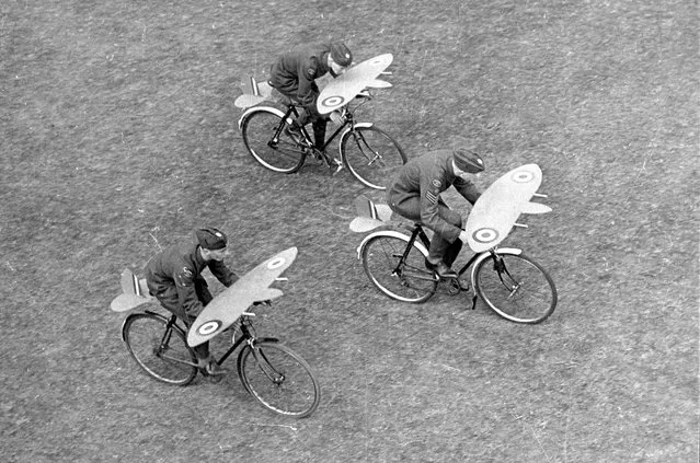 Three Air Cadets from the RAF's Coulsdon and Purley Squadron practice 'formation flying' using bicycles with wings over the handlebars, 29th September 1942.  (Photo by Hulton Archive/Getty Images)