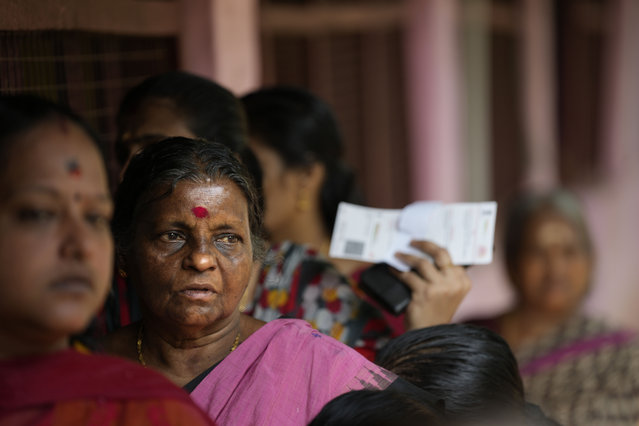 People queue up to vote during the second round of voting in the six-week-long national election near Palakkad, in Indian southern state of Kerala, Friday, April 26, 2024. (Photo by Manish Swarup/AP Photo)