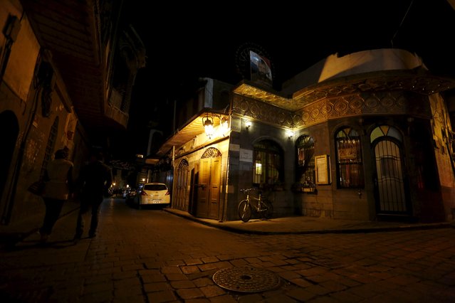 La Marionnette Pub is seen in Damascus, Syria, March 11, 2016. In Damascus's Old City, just a mile from the battered frontline between government and rebel-held territory, young Syrians smoke, drink beer or soft drinks, and talk about anything but the war. The revival of activity in this once-vibrant quarter is part of efforts to project an air of normality in the Syrian capital, even as the five-year-old war that has killed more than 250,000 people and created 5 million refugees continues to rage nearby. (Photo by Omar Sanadiki/Reuters)