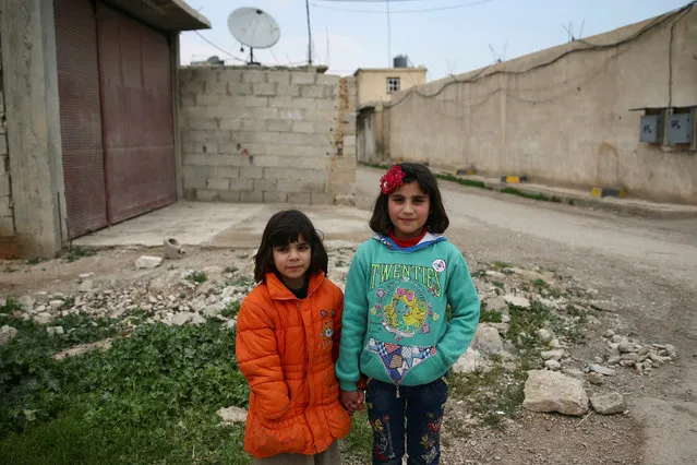 Girls pose in the rebel held besieged Douma neighbourhood of Damascus, Syria April 1, 2017. (Photo by Bassam Khabieh/Reuters)