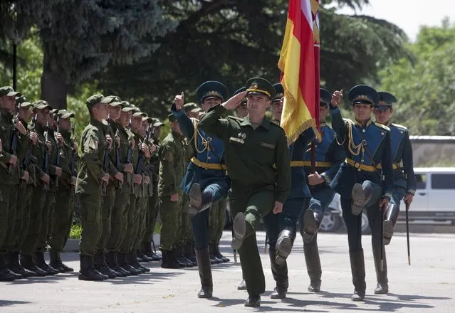 Servicemen of the military forces of South Ossetia march during an oath of allegiance ceremony in Tskhinvali, the capital of the breakaway region of South Ossetia, Georgia, July 5, 2015. (Photo by Kazbek Basaev/Reuters)