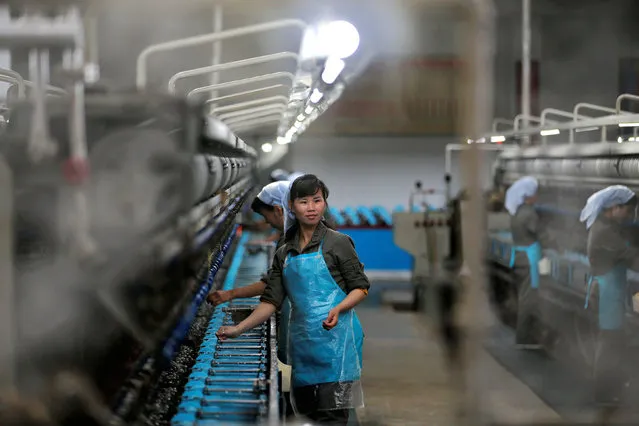 Women work at the Kim Jong Suk Pyongyang textile mill during a government organised visit for foreign reporters in Pyongyang, North Korea May 9, 2016. (Photo by Damir Sagolj/Reuters)