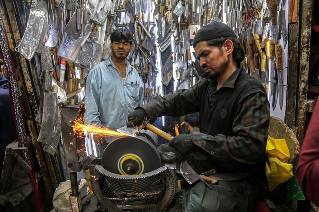 A blacksmith sharpens knives for sale ahead of the Muslim festival of Eid al-Adha in Kabul, Afghanistan, 16 June 2024. Eid al-Adha is one of the holiest Muslim holidays of the year. It marks the yearly Muslim pilgrimage, known as Hajj, to visit Mecca. During Eid al-Adha, Muslims slaughter goats, sheep, and cattle in commemoration of the Prophet Abraham's readiness to sacrifice his son to show obedience to God. They split the meat into three parts; one for family, one for friends and relatives, and one for the poor and needy. (Photo by Samiullah Popal/EPA/EFE)