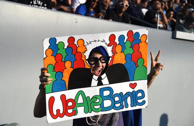 Supporters of Democratic presidential candidate Bernie Sanders attend an election night rally in Carson, California, May 17, 2016. Sanders scored a decisive victory over Hillary Clinton in the Democratic primary in Oregon, boosting his argument for keeping his underdog campaign alive through the conclusion of the primary process. Several US networks called the Pacific northwest state for the liberal Sanders, who was leading the former secretary of state 53 percent to 47 percent. Earlier in the night, Clinton claimed victory in an extraordinarily tight race in the state of Kentucky. (Photo by Robyn Beck/AFP Photo)