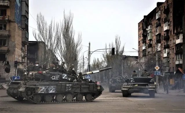 Russian military vehicles move in an area controlled by Russian-backed separatist forces in Mariupol, Ukraine, Saturday, April 23, 2022. (Photo by Alexei Alexandrov/AP Photo)