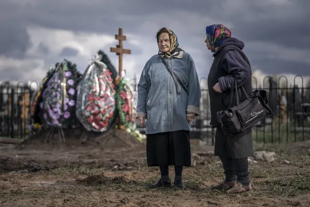 Two women who sing as part of burial ceremonies prepare to sing traditional songs for yet another of many burials at a cemetery in Borodyanka, Ukraine on Tuesday, April 26, 2022. U.S. Secretary of State Antony Blinken told Congress on Tuesday that the Biden administration hasn't seen any evidence that Russian President Vladimir Putin plans to end the war in Ukraine through diplomatic efforts. (Photo by Ken Cedeno/UPI/Rex Features/Shutterstock)