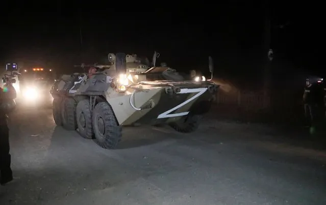 A convoy of pro-Russian troops, which escorts buses with service members of Ukrainian forces from the besieged Azovstal steel mill, drives away in the course of Ukraine-Russia conflict in Mariupol, Ukraine on May 16, 2022. (Photo by Alexander Ermochenko/Reuters)