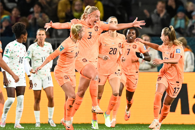 Netherlands' defender #03 Stefanie van der Gragt (C) celebrates with her teammates after scoring her team's first goal during the Australia and New Zealand 2023 Women's World Cup Group E football match between the Netherlands and Portugal at Dunedin Stadium in Dunedin on July 23, 2023. (Photo by Sanka Vidanagama/AFP Photo)